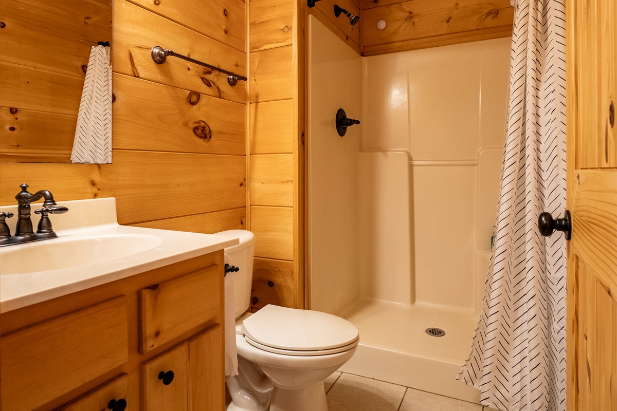 A well-appointed bathroom on the lower level ensures comfort for everyone no matter where they're relaxing.