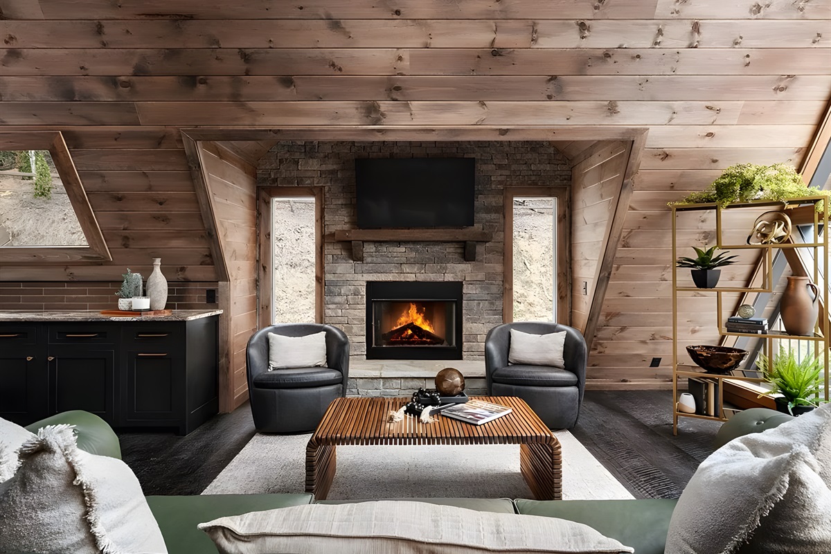 From the couch: fire dancing, armchairs waiting, comfort enveloping you. This is the art of doing nothing beautifully.