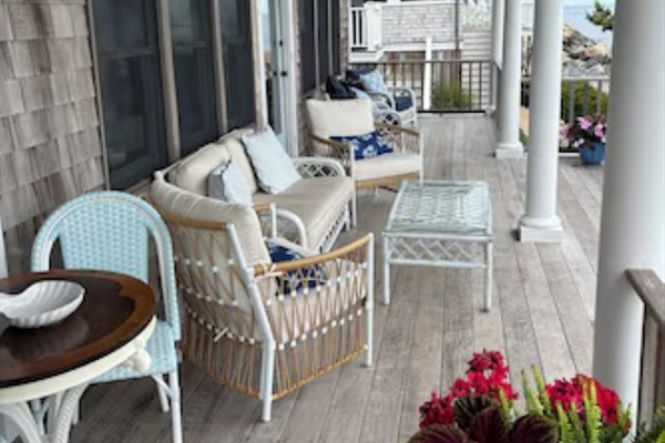Relax on the charming covered porch with comfortable seating and ocean breezes. 🌊