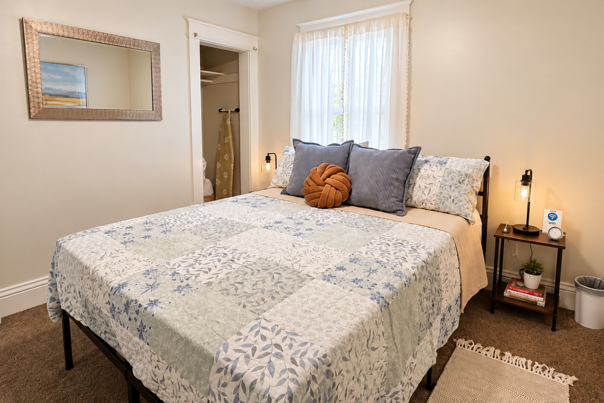 Cozy queen bedroom with Smart TV and thoughtful bedside amenities.