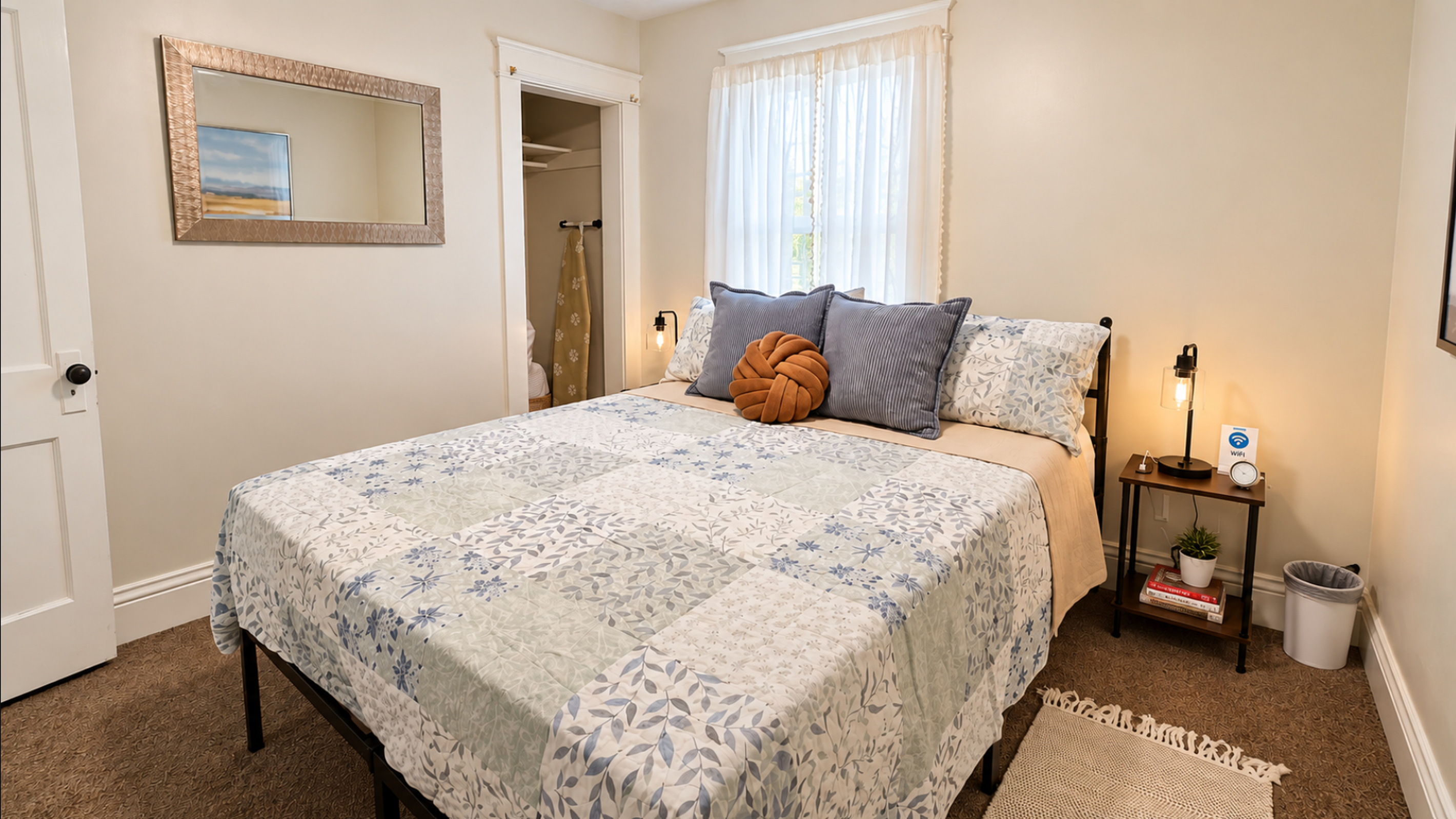 Cozy queen bedroom with Smart TV and thoughtful bedside amenities.