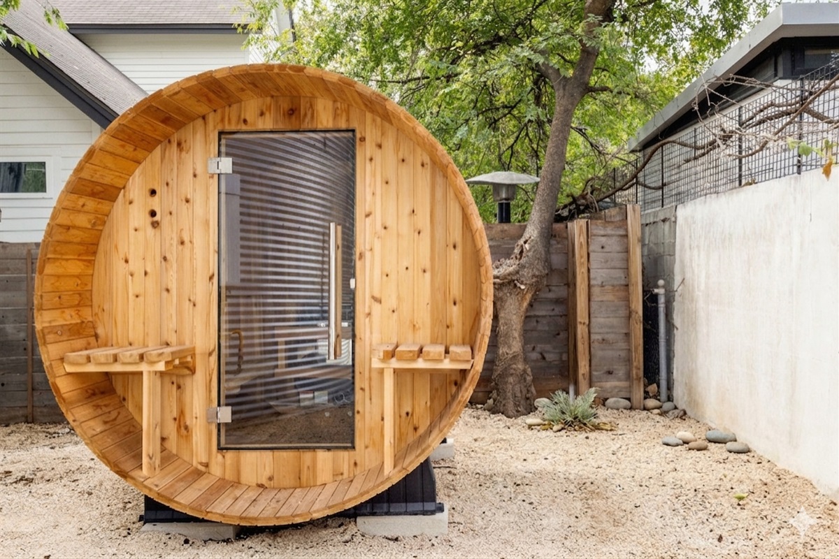 Relax and recharge in this private outdoor barrel sauna—your own spa-style retreat surrounded by nature, perfect for unwinding after a day exploring the city.