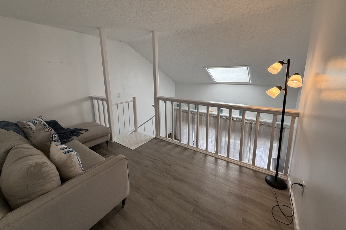 Cozy up and unwind in the loft's comfortable seating area