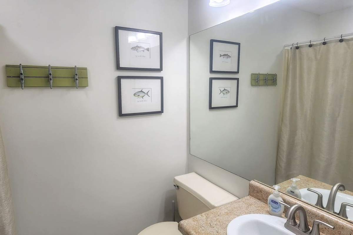Soak after a long beach day in the tub or rinse fast before dinner in the shower &mdash; the queen ensuite gives you both options without leaving your suite.