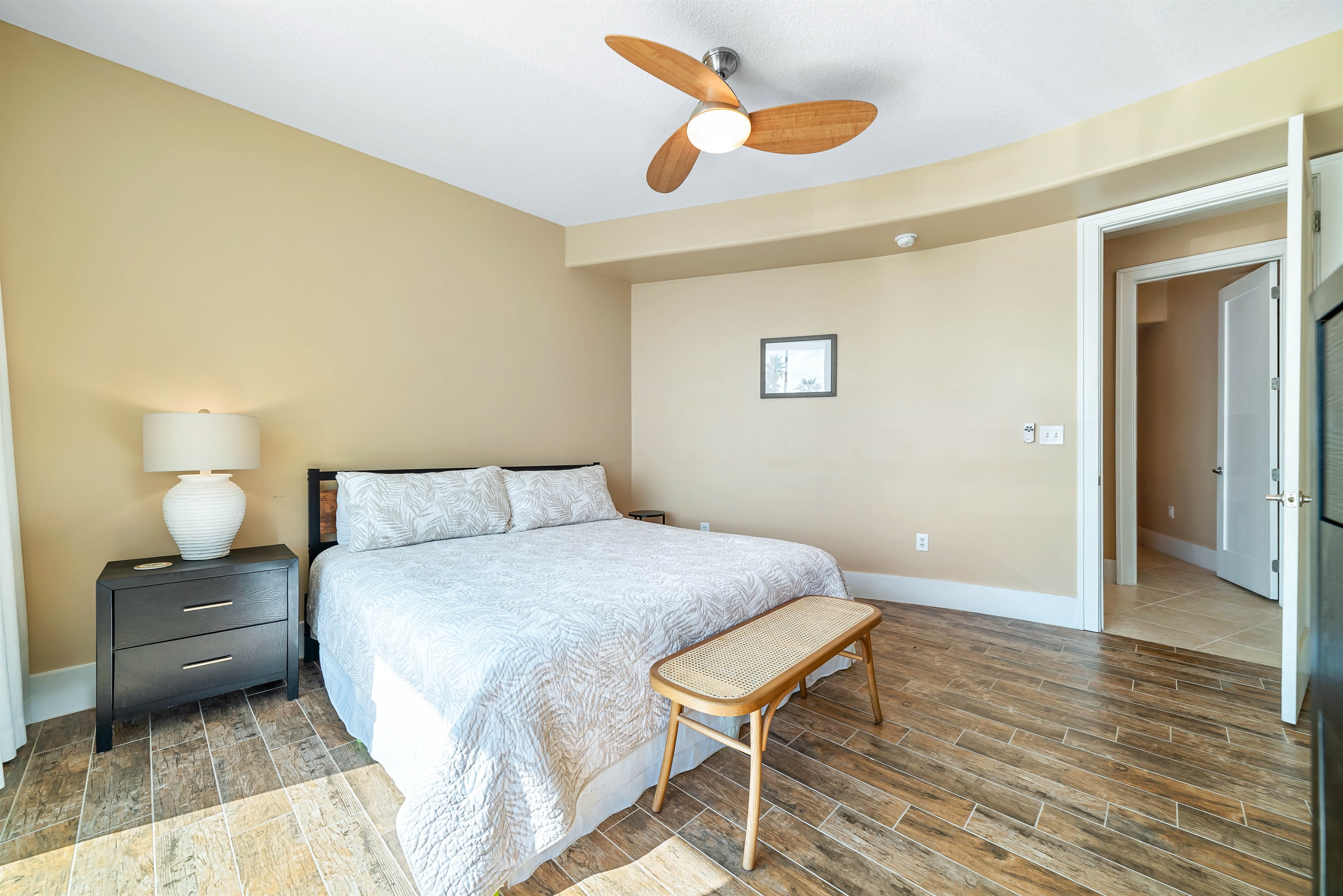Thoughtful details and comfortable furnishings define this inviting guest room with king-size bed, creating a relaxing and enjoyable space.