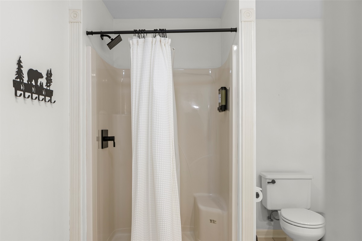 Full Bathroom 1: Refresh in style with sleek finishes and a whimsical bear-themed decor!
