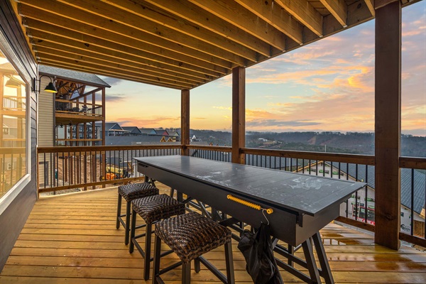 A long table that seats six can be pulled apart and easily converted into a shuffleboard game table