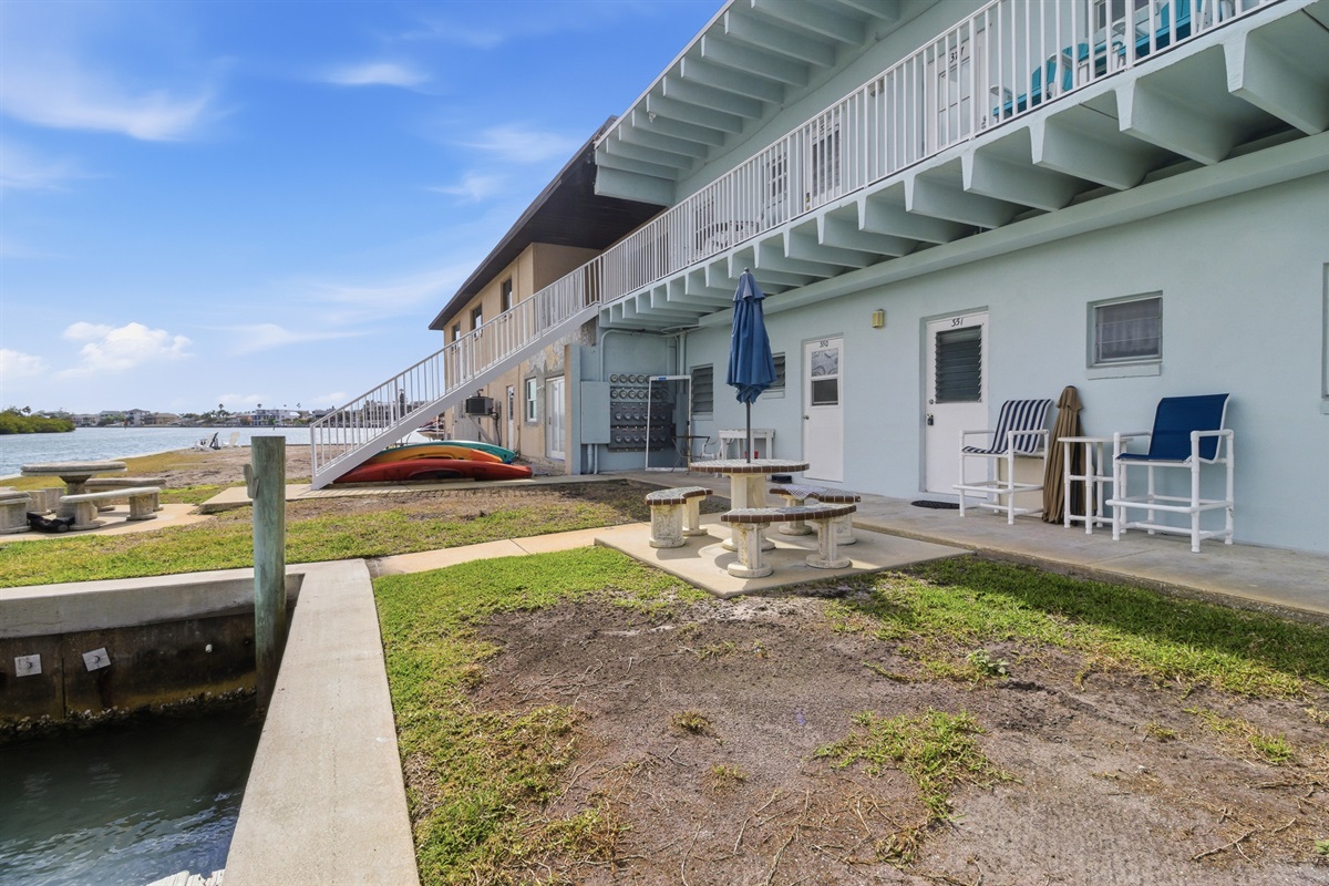 The back door of the unit opens to the Intracoastal Waterway, with a shared dining table offering stunning waterfront views!