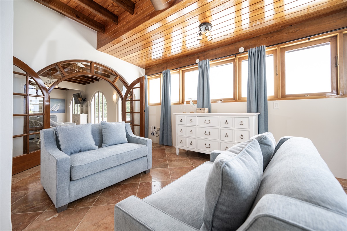 Main Floor Primary Bedroom: Extra wide doorway entry to the primary bedroom with two twin, memory foam sleeper sofas