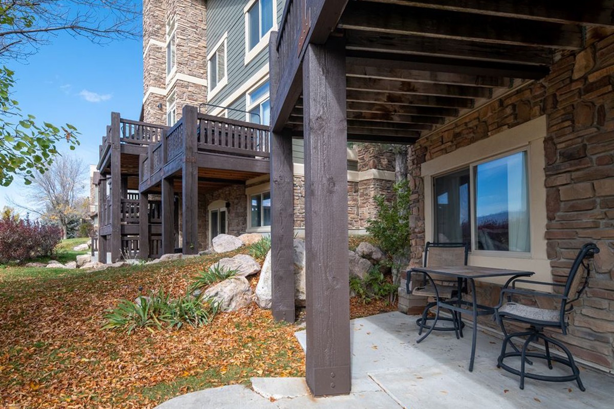 Private lower patio with seating and easy access to the outdoors.