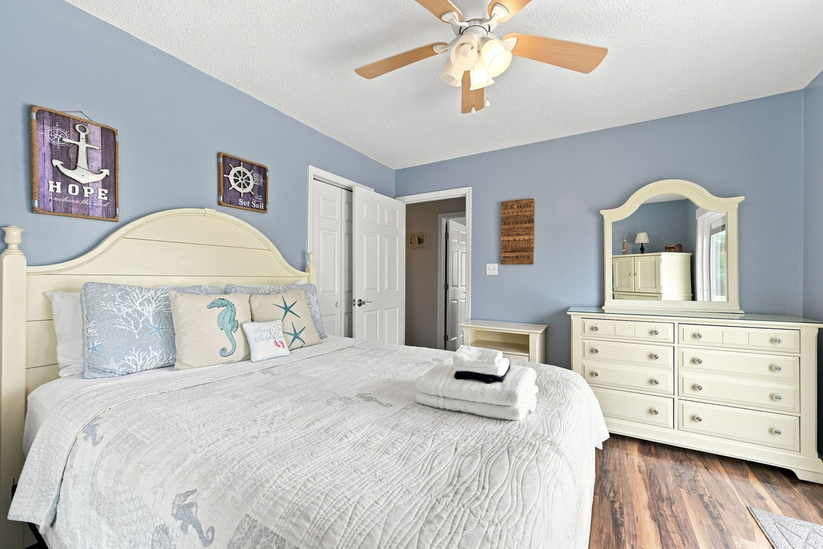 Wake up refreshed in this inviting queen bedroom with ample storage and a relaxing atmosphere