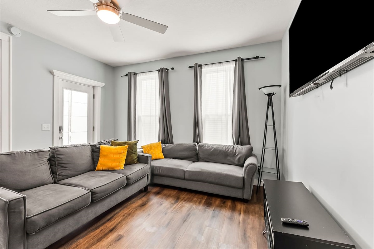 Enjoy downtime in the living room with plenty of seating, entertainment setup.