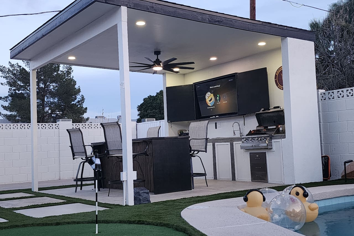 Our large gazebo with bar seating, built-in grill, sink and mini fridge is perfect for a beer or cocktail, dining, and relaxing. Enjoy your favorite movies, shows or sports on the 65" TV, which features free Peacock streaming.