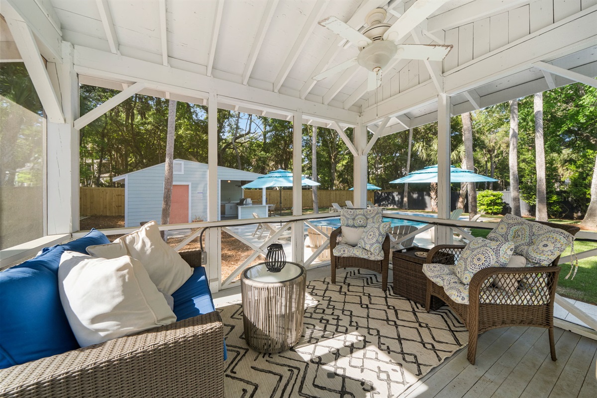Screened porch is a great place to enjoy a book or relax in the evening to the sounds of the ocean | IOP Escapes Beach Blessing | 3705 Hartnett Blvd, Isle of Palms, SC