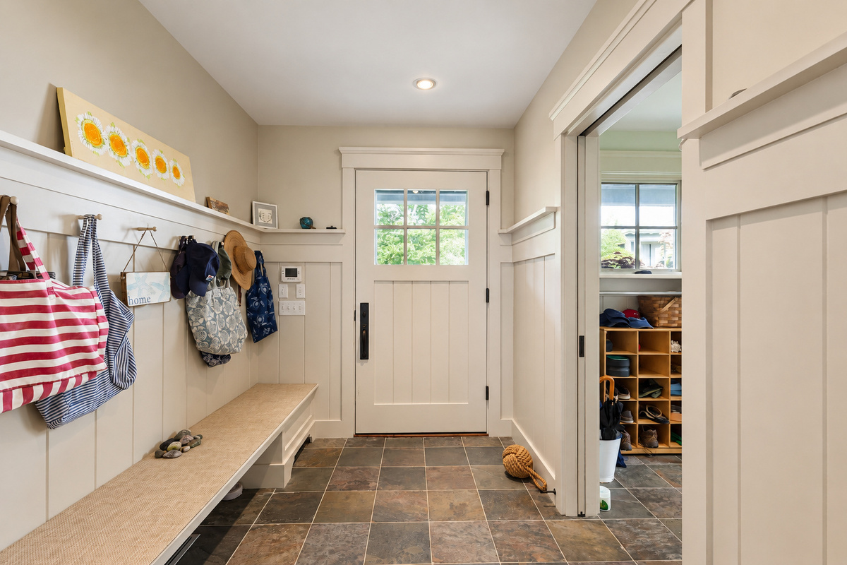 Mudroom entry with bench and hooks