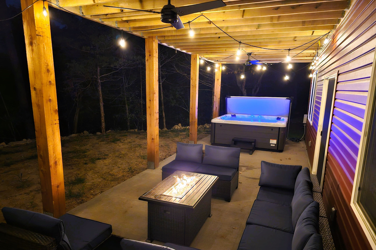 Evenings made easy with cozy seating and a fire table on the covered patio.