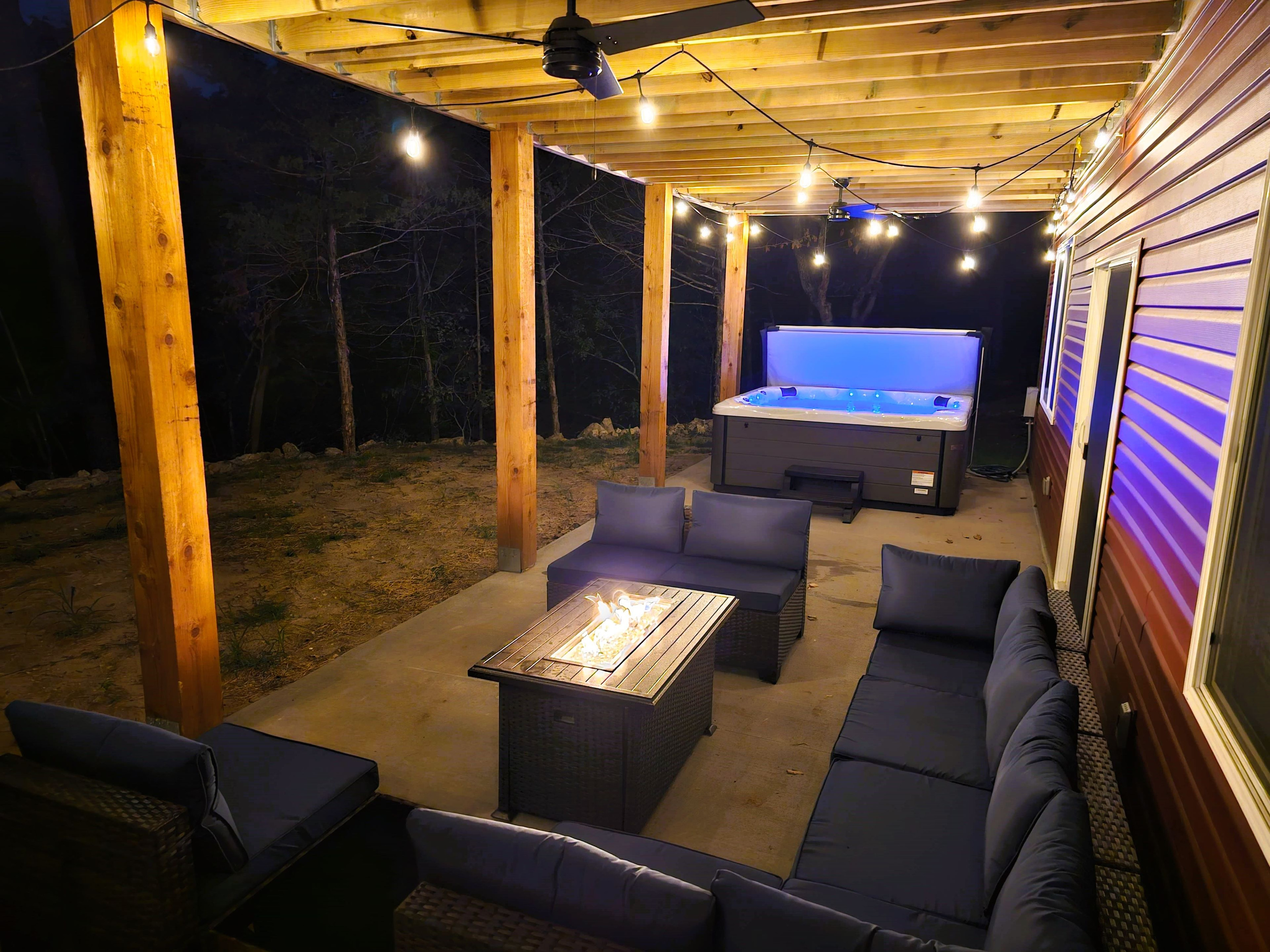 Evenings made easy with cozy seating and a fire table on the covered patio.