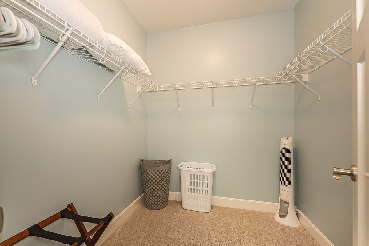 Each bedroom has a blanket, fan, luggage rack, hangers, and hampers.