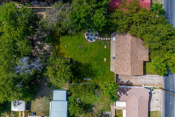 Direct overhead of the backyard shows layout of games and fire pit area