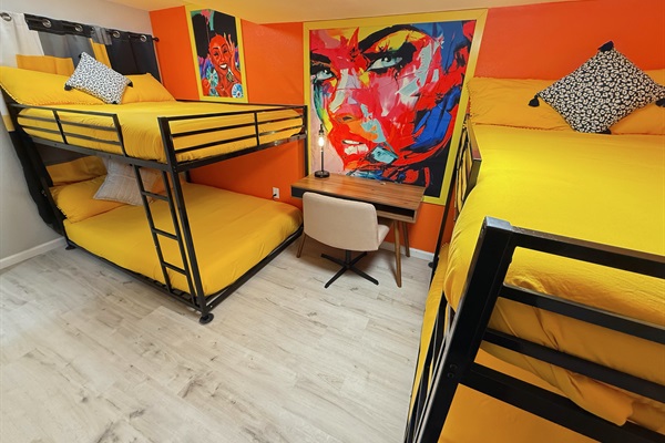 A vibrant and cozy bunk room designed for fun and relaxation. Perfect for unwinding or getting creative in style.