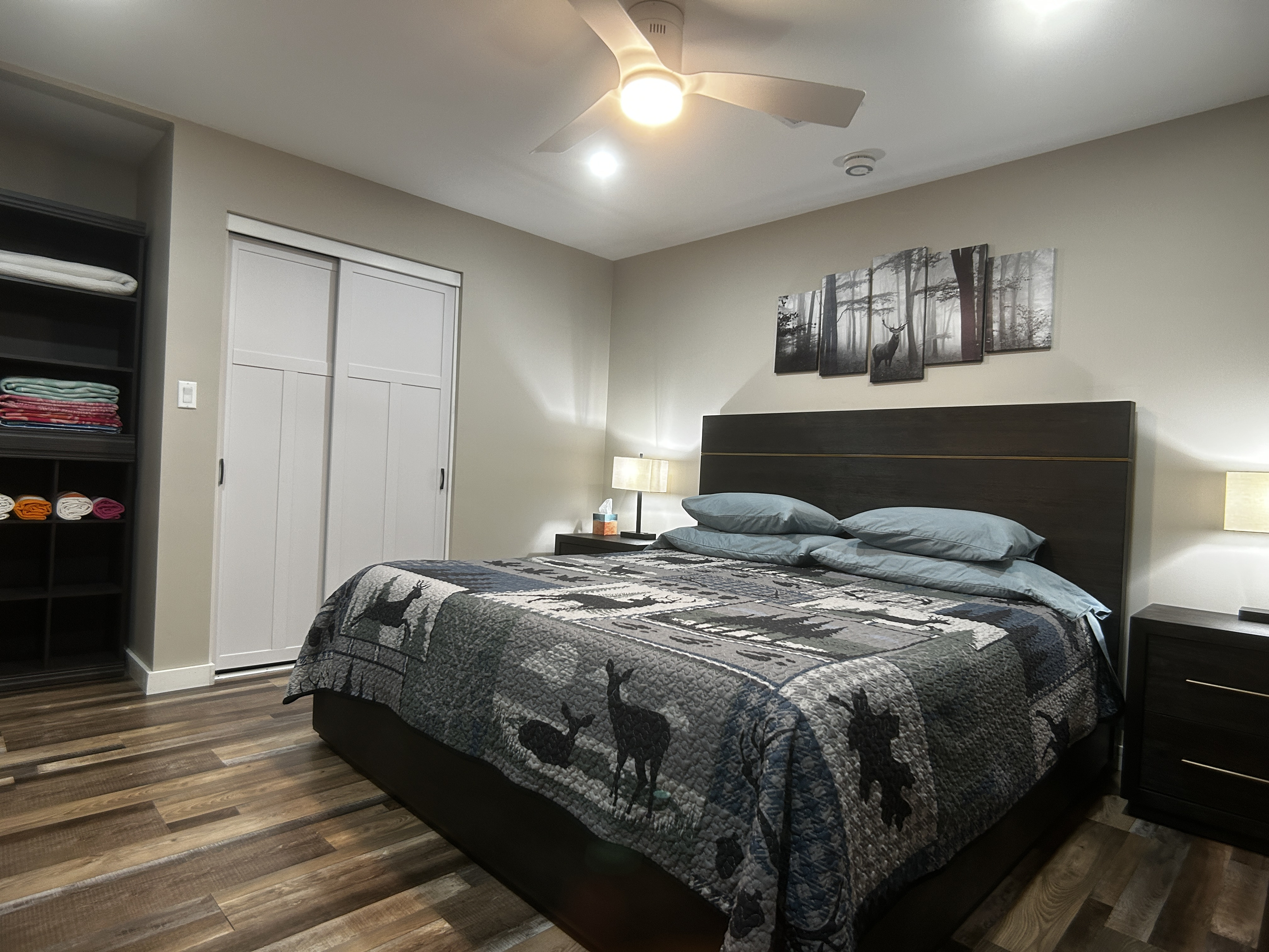 King size bed, dimmable lights, room darkening curtains and ceiling fan.