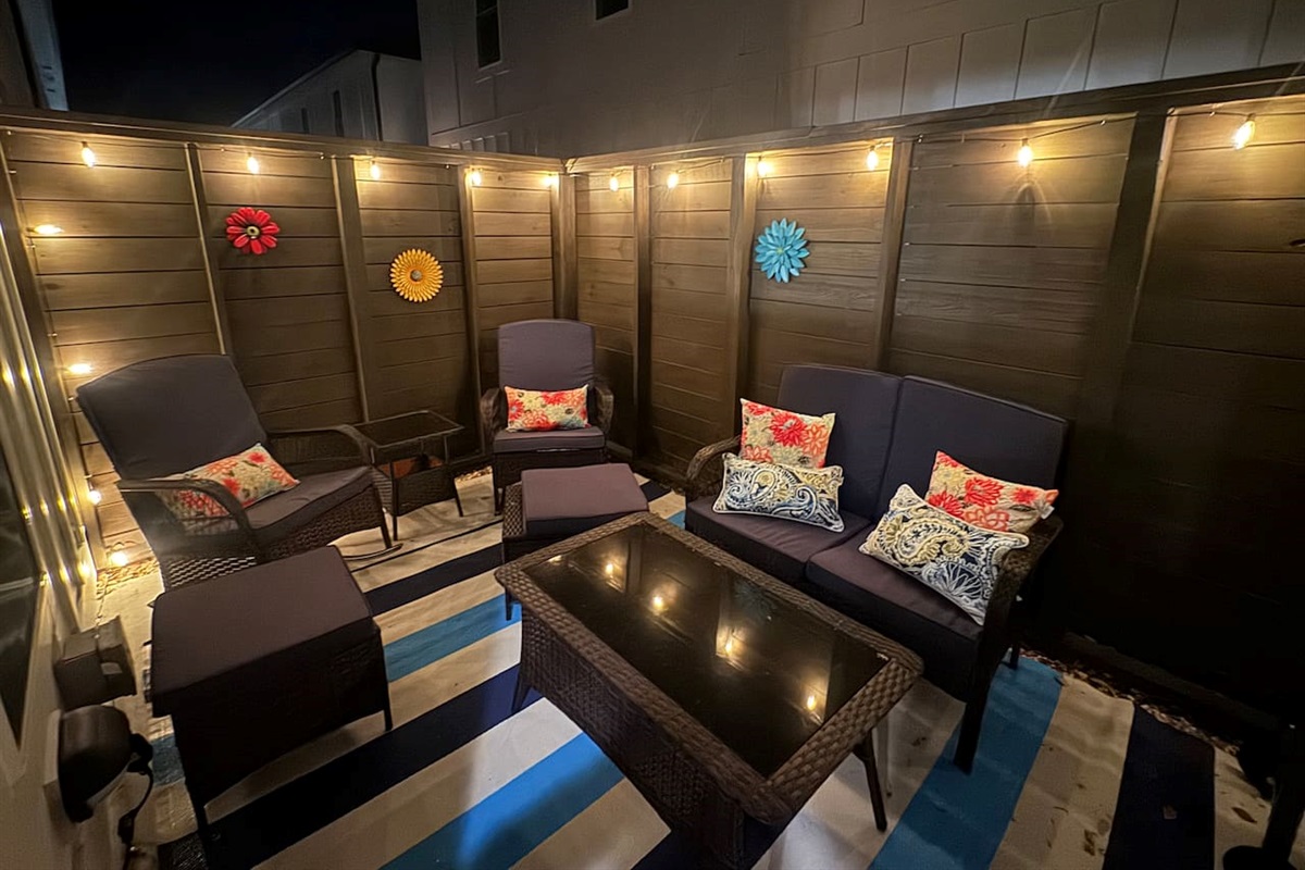 Grill with tools and bar cartColorful lounge seatingOutdoor shower Teak dining set for 8-10 available in front of unit (community amenity)Enclosed for pets w/ baby gates