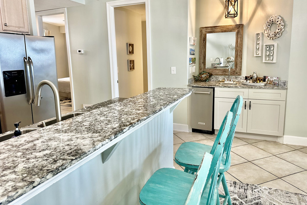 The wet bar is adjacent to the kitchen!