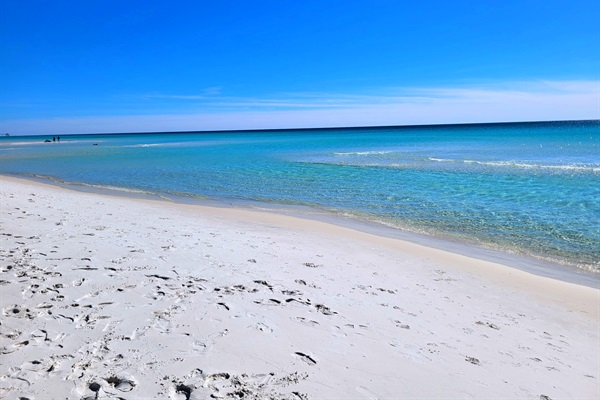 White sand beach with beautiful emerald waters