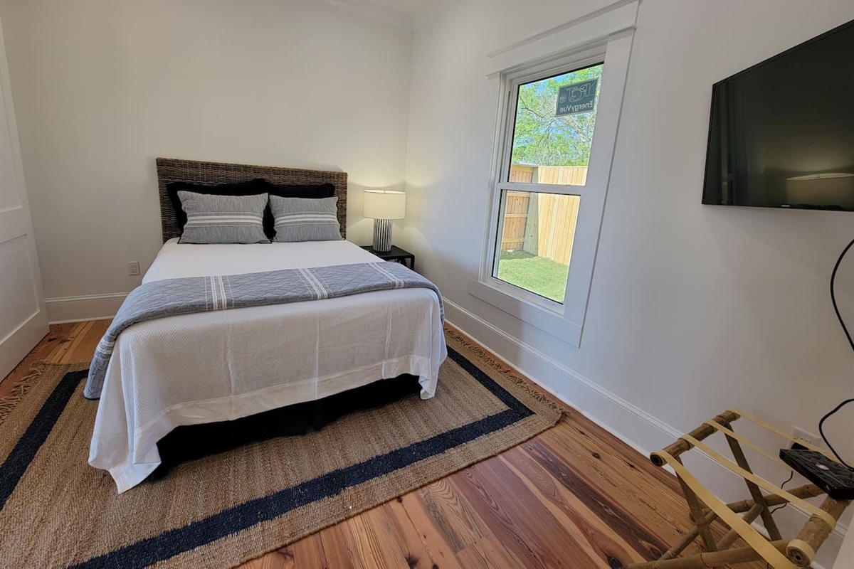 Guest bedroom with queen bed.