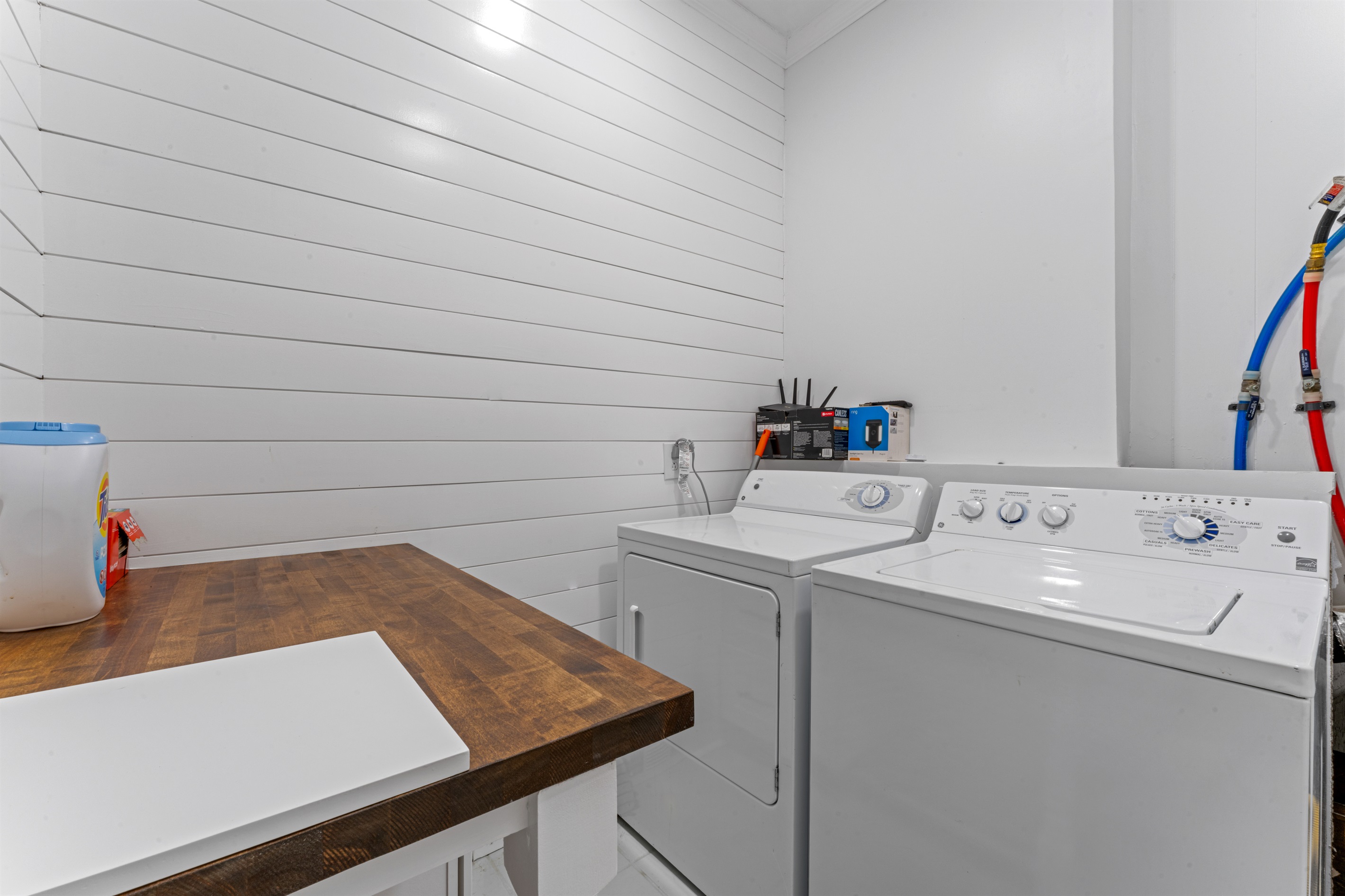 Convenient laundry room with washer, dryer, and a spacious folding station — perfect for longer stays and keeping everyone fresh throughout your trip.