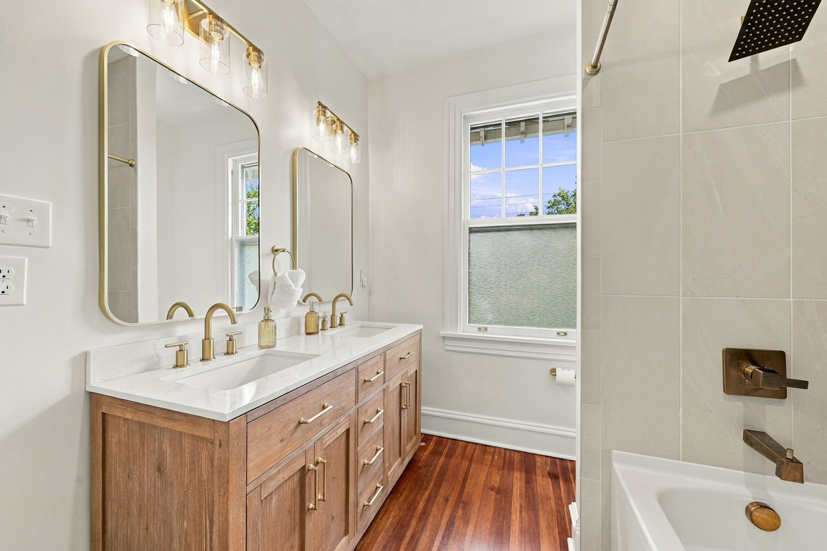 Spa-Like Bathroom: Enjoy dual sinks, elegant fixtures, and natural light for a refreshing retreat!