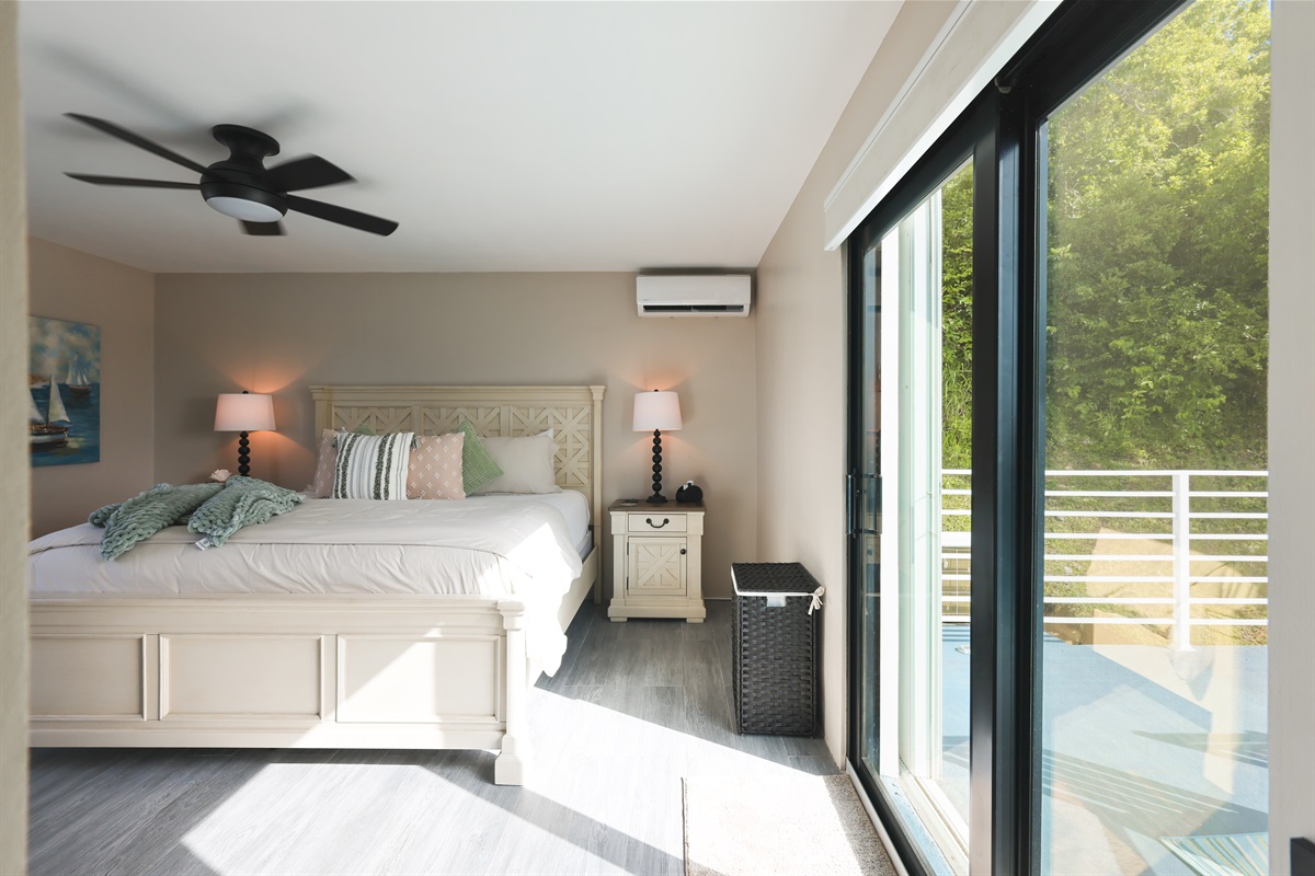 A restful escape with direct access to an outdoor space and a ceiling fan and ac unit to keep it cool while you're inside.