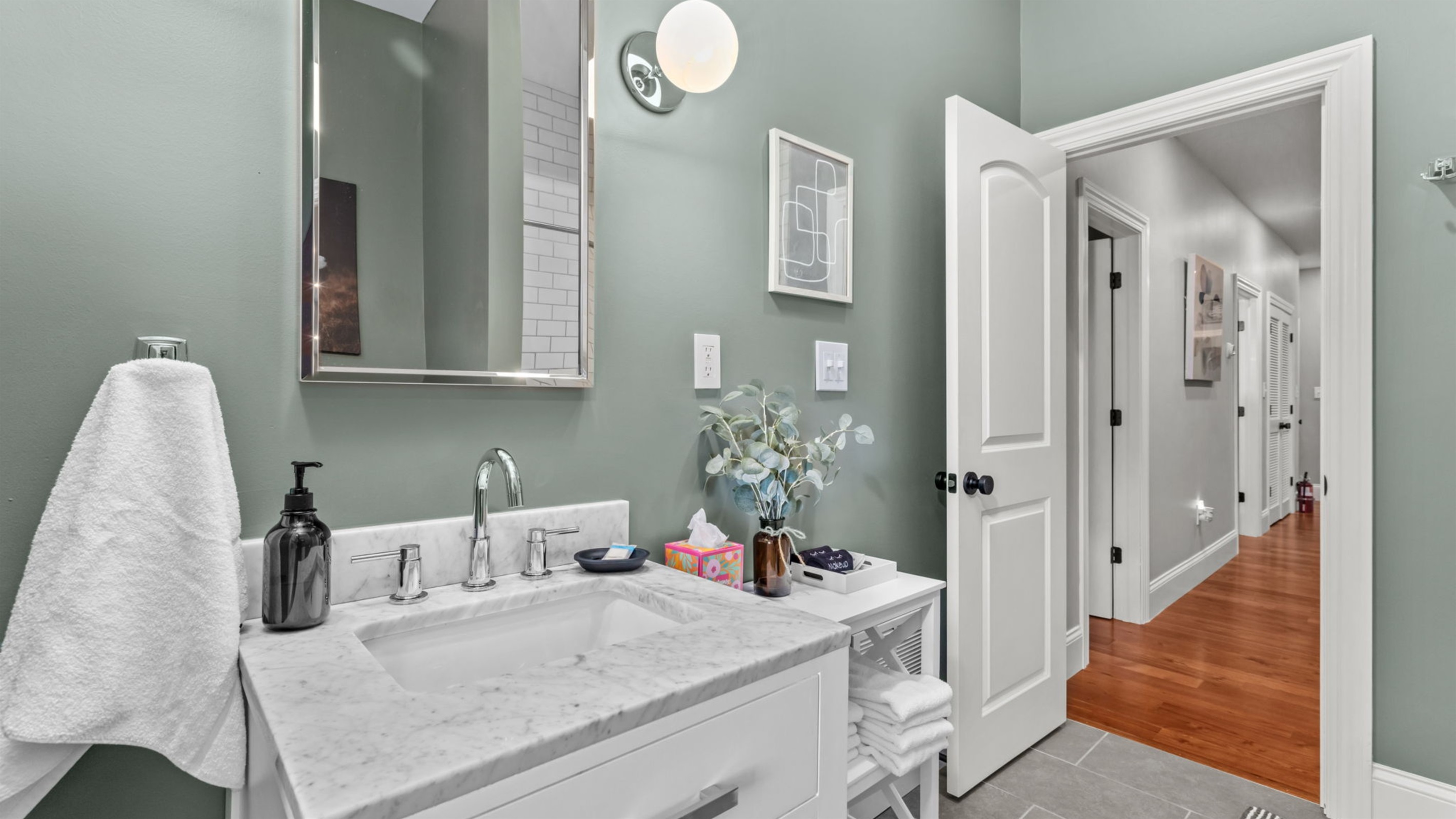 Shared bathroom conveniently located at the end of the hall on the second level.