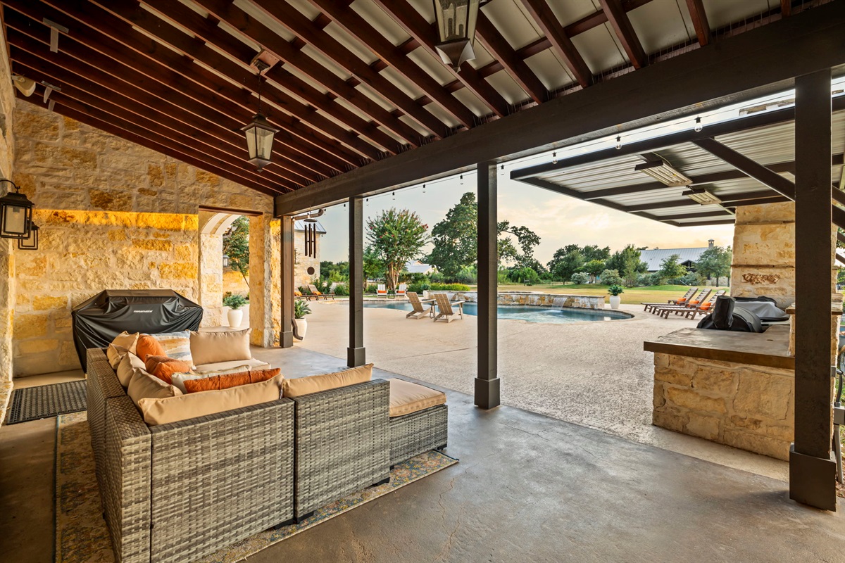 A BBQ grill on a spacious covered patio, ideal for outdoor cooking and entertaining.