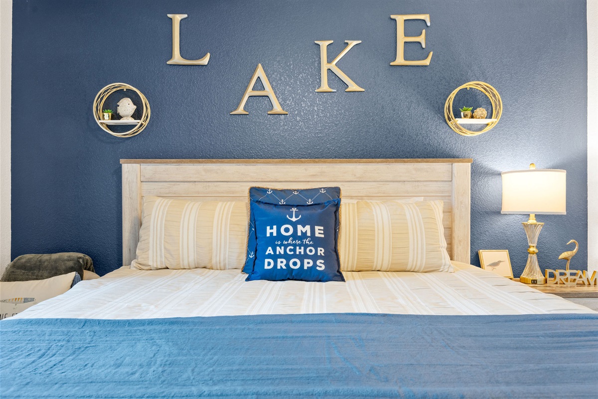 King bed with cozy lake-inspired décor.