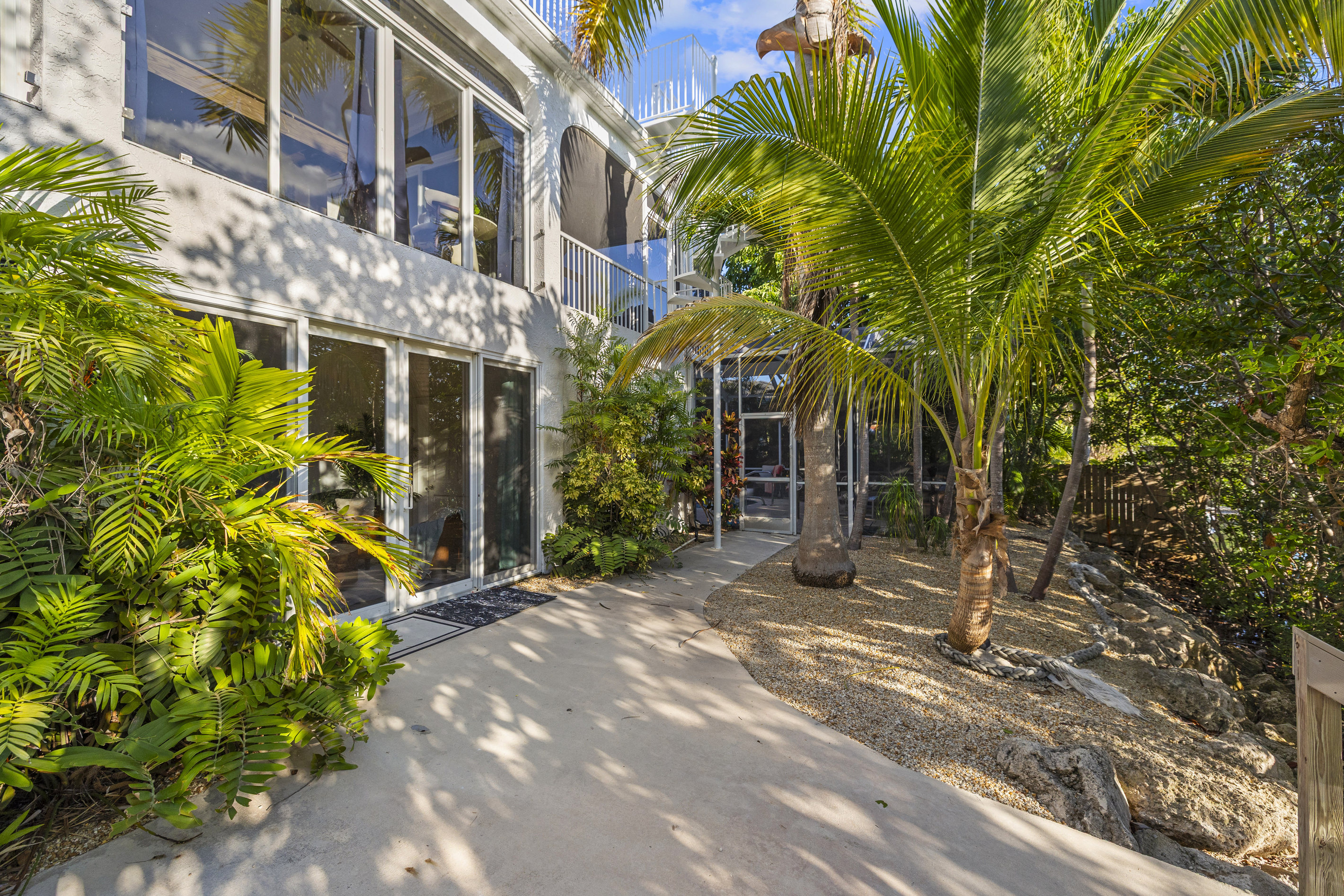 Heading across the back of the house, the dock is to your right and the pool straight ahead.