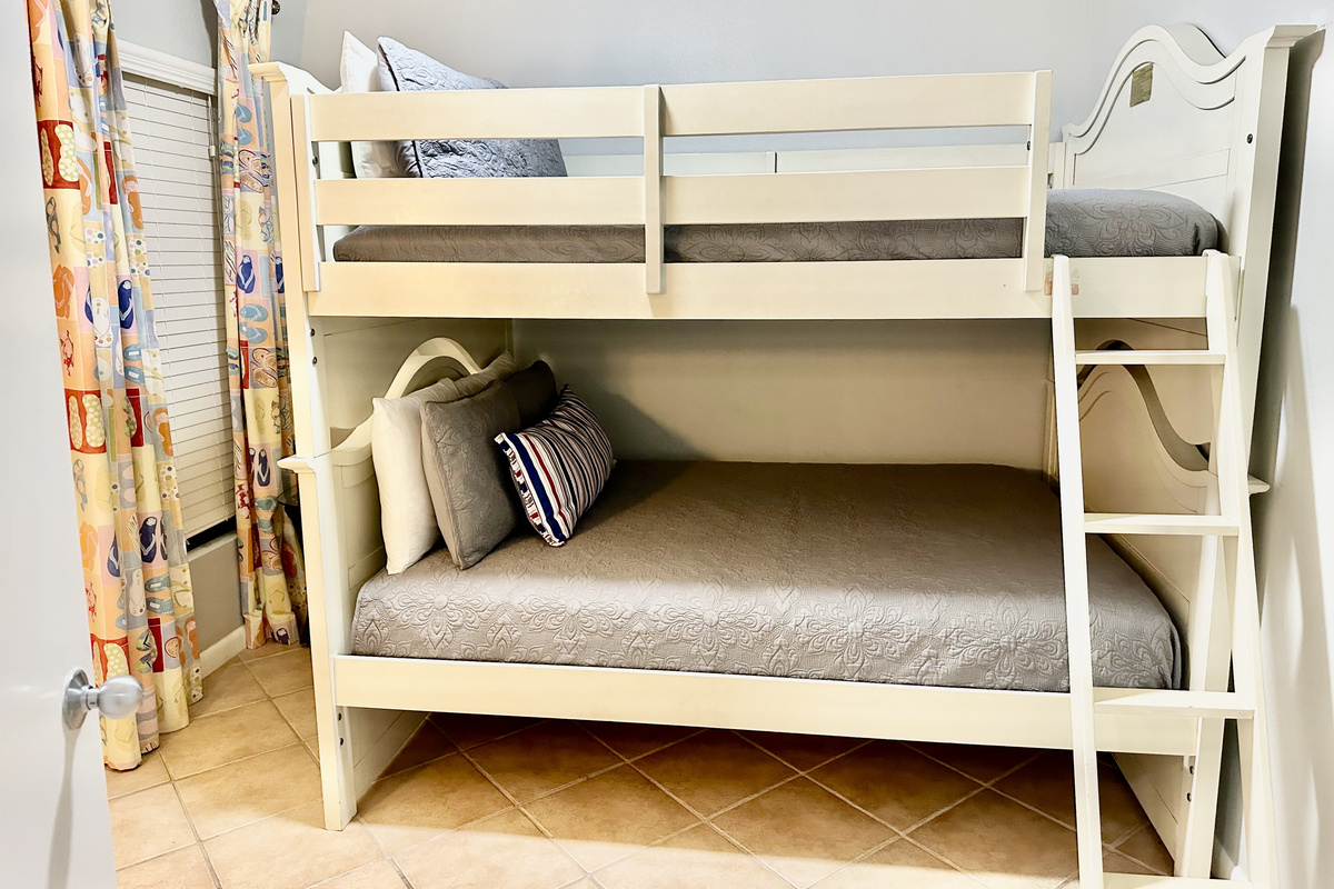 The kids will LOVE this room!! Their bed features a full sized bottom bunk, and twin top bunk!