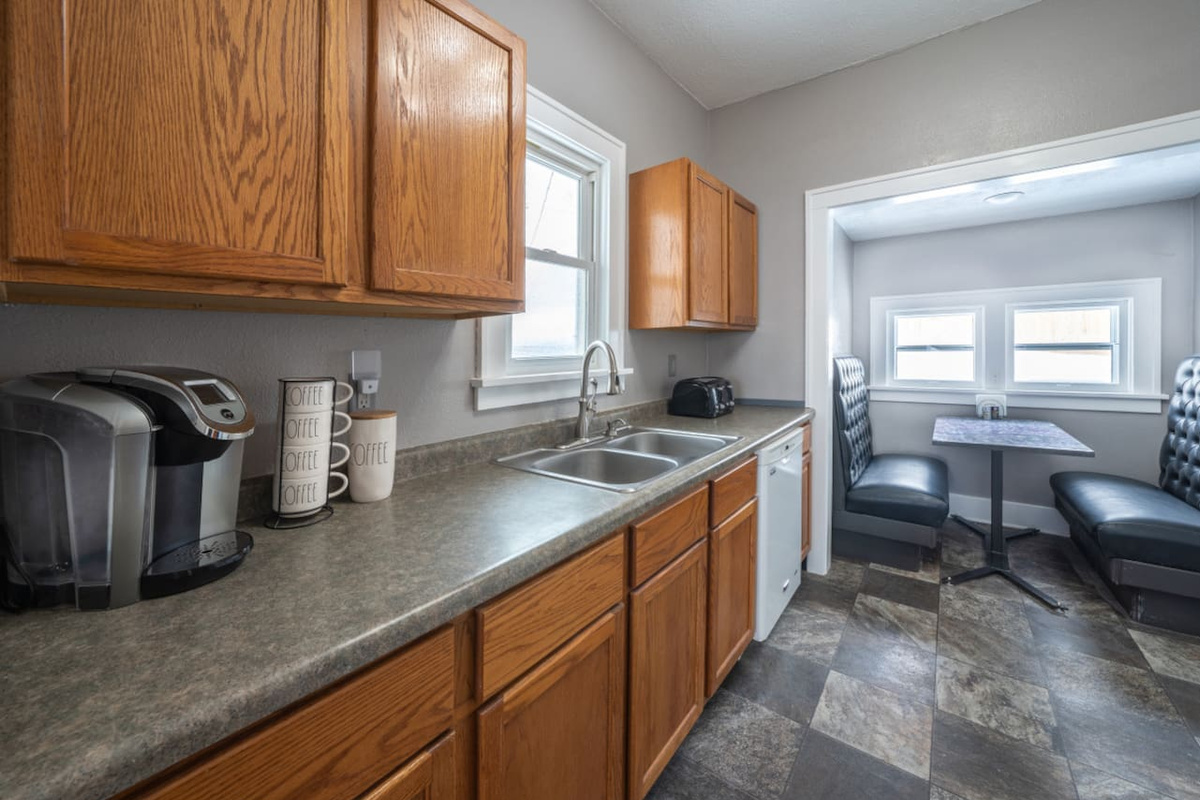 The kitchen is fully stocked. A kuerig with coffee, creamer, and sugar is provided.