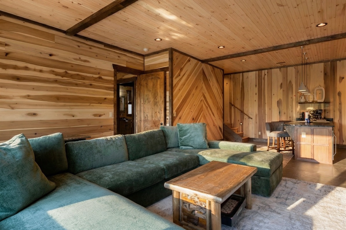 Unwind on the plush sofa in this spacious lounge area, perfect for movie nights or lazy afternoons.