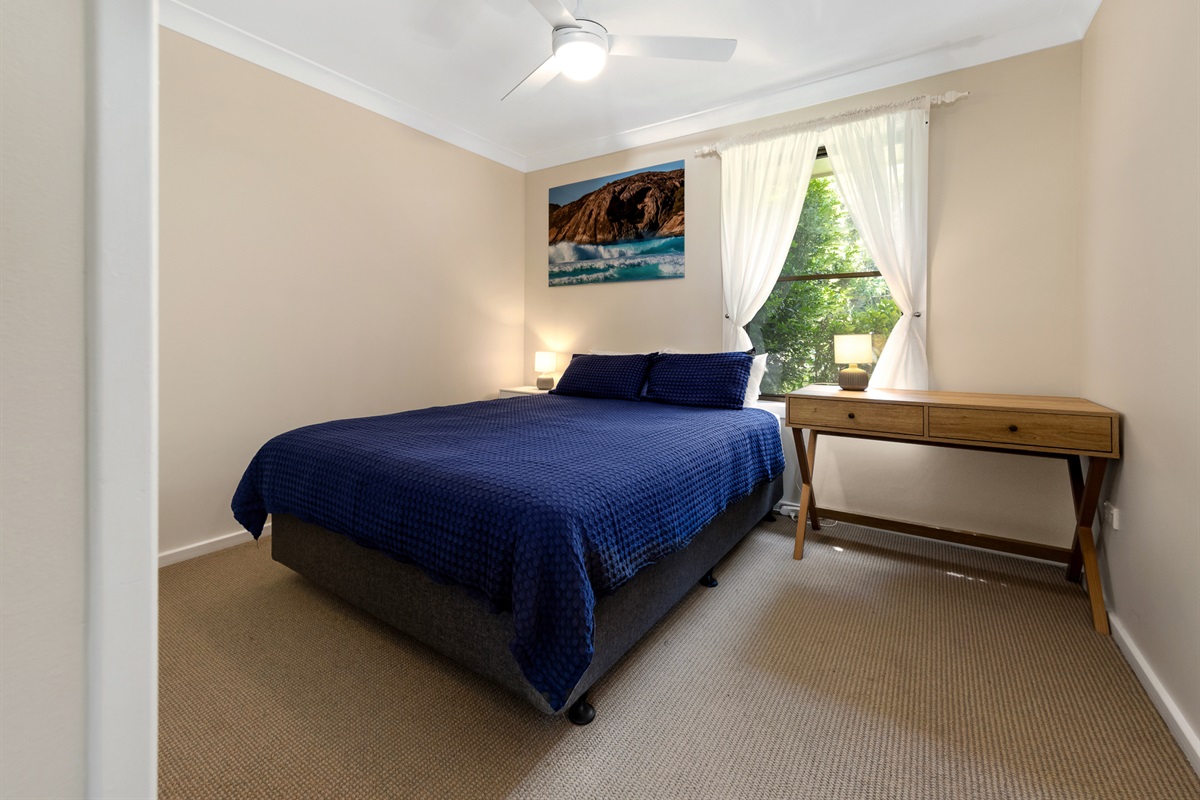 This second upstairs bedroom has a queen bed, giving Bertie’s 3 Beaches another practical bedroom close to the kitchen, dining and balcony level.