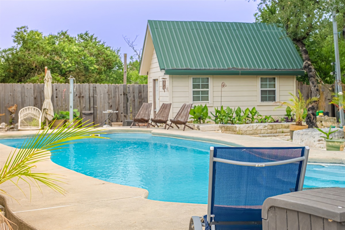 Welcome to your own private Backyard Oasis. Spa jets in pool bench seats & separate hot tub. Natural gas grill, oversized hammock for two, heated pool. Could it get any better?! Come, dive in ️