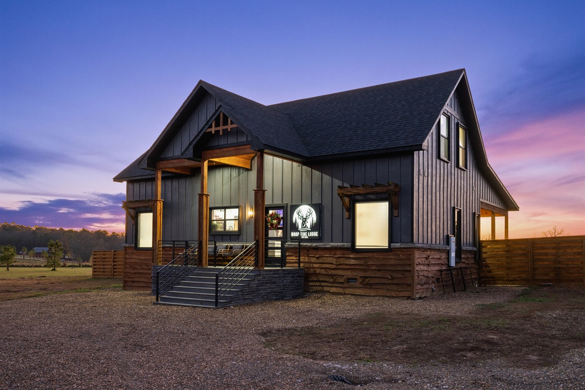 The front view shows off the home’s beautifully balanced design, with modern finishes and rustic charm paired perfectly.