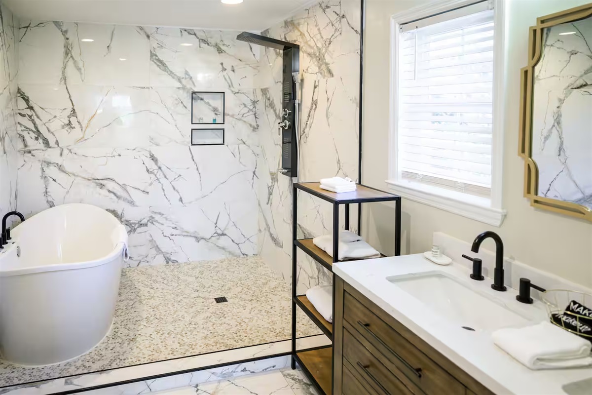 Unwind in style with a deep soaking tub and walk-in shower that feels like a five-star spa.