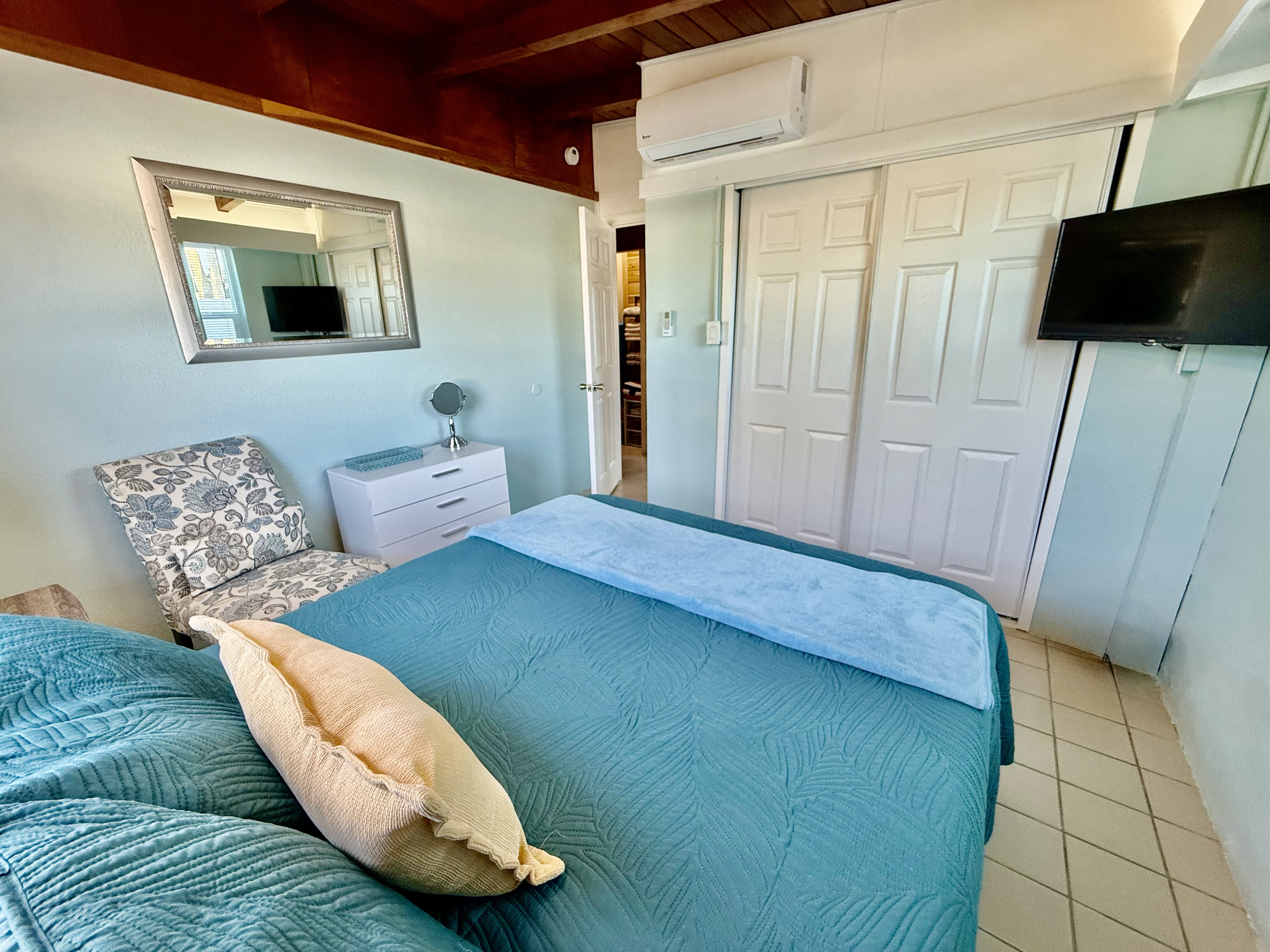 Bright and coastal Queen bedroom