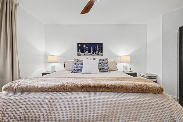 King bedroom 4 upstairs with 55" Smart TV, blackout curtains, ceiling fan, desk and chair