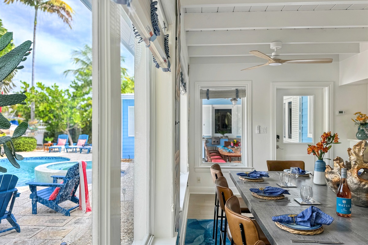 The dining are aopens up to the backyard pool.