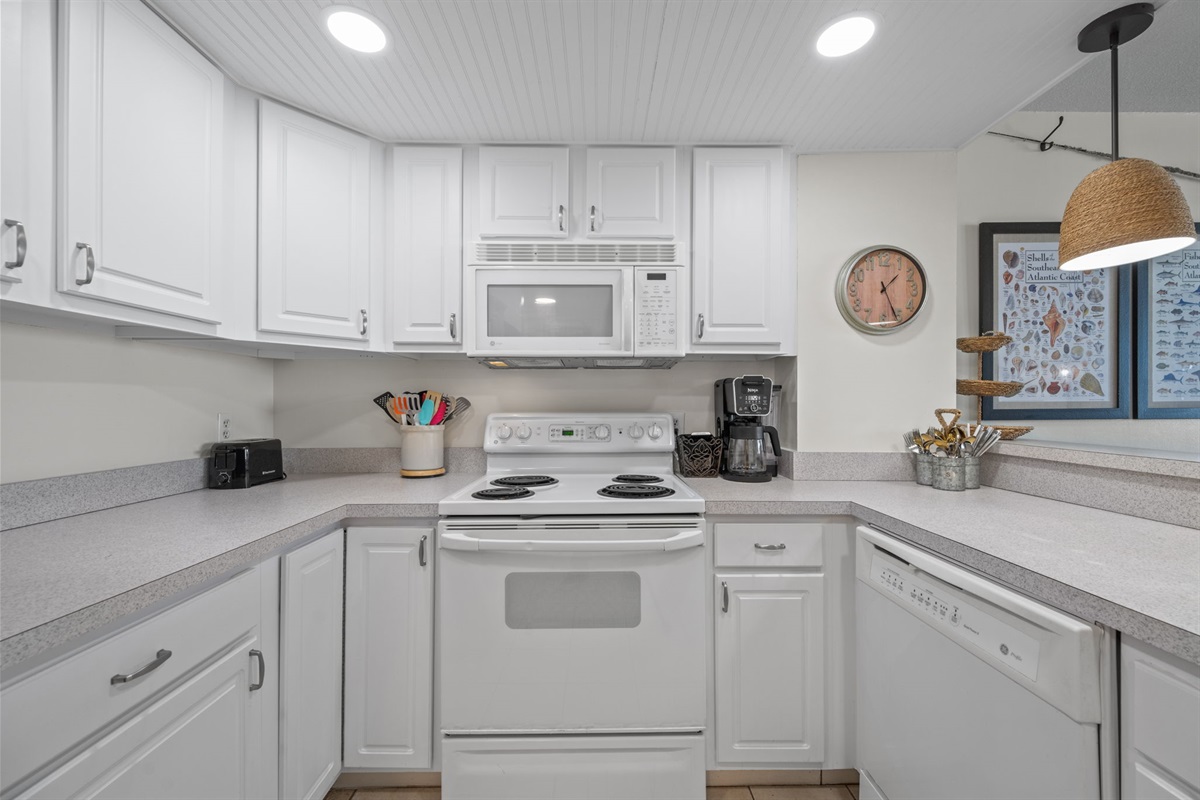 Clean and functional kitchen setup with full appliances ready for home cooking