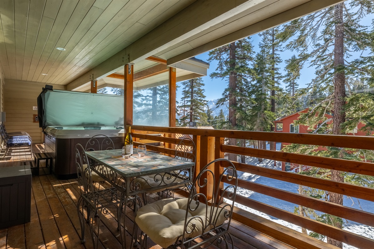 Back balcony features a hot tub and seating, shared with one other condo.