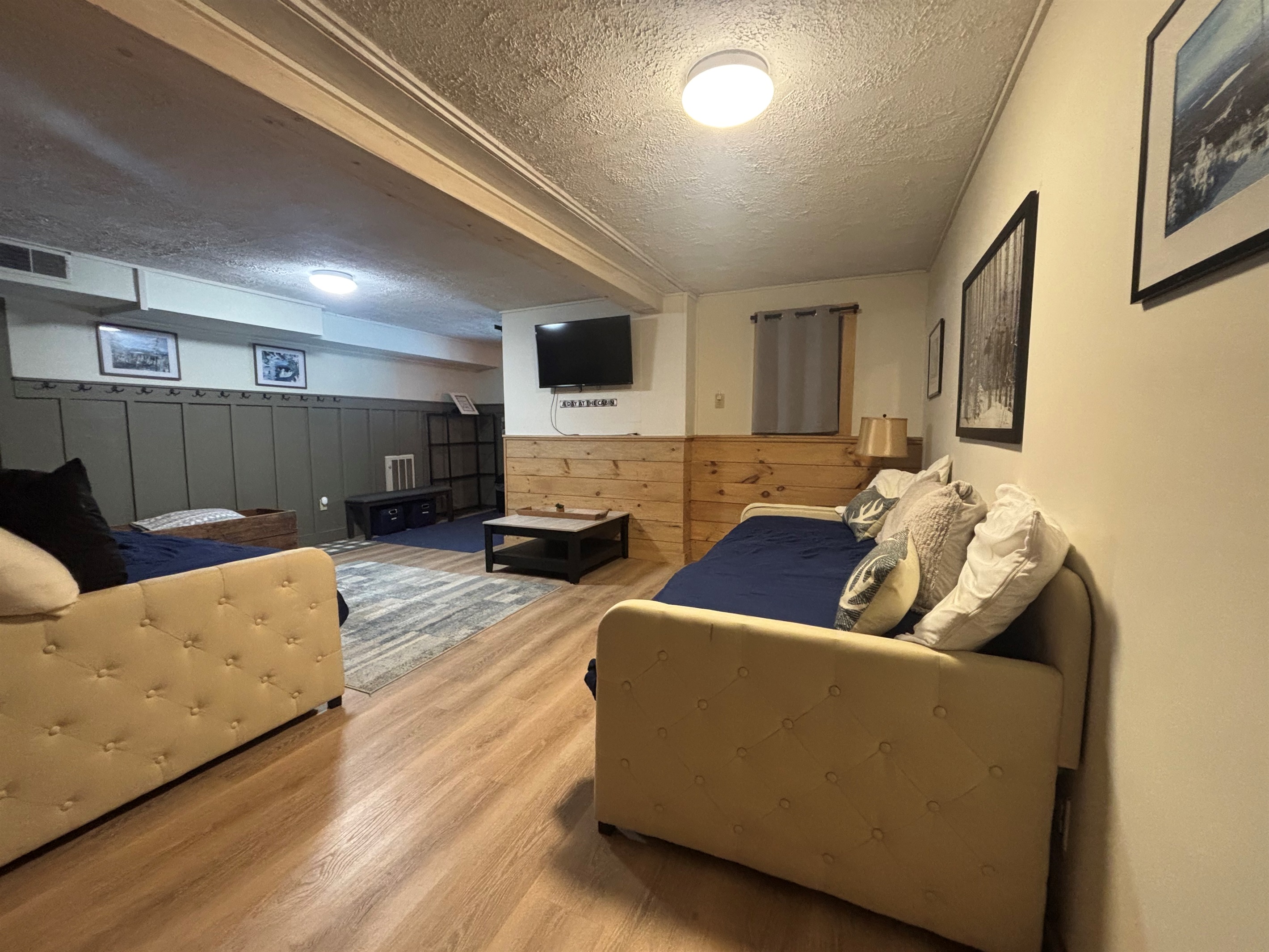 Lower level sitting area with day beds and trundles