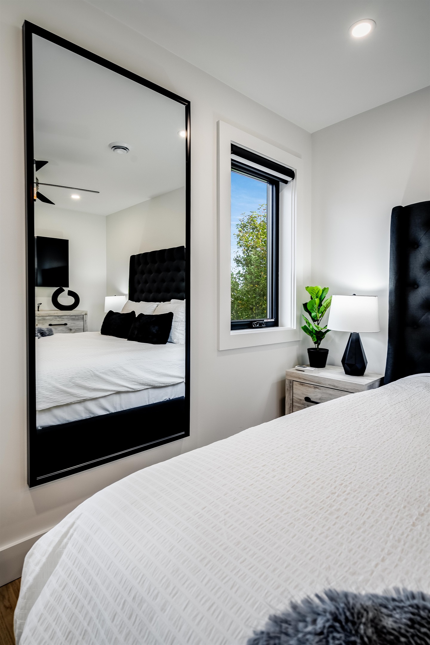 King Bedroom with Sleek nightstands with modern lamps provide functional style.
